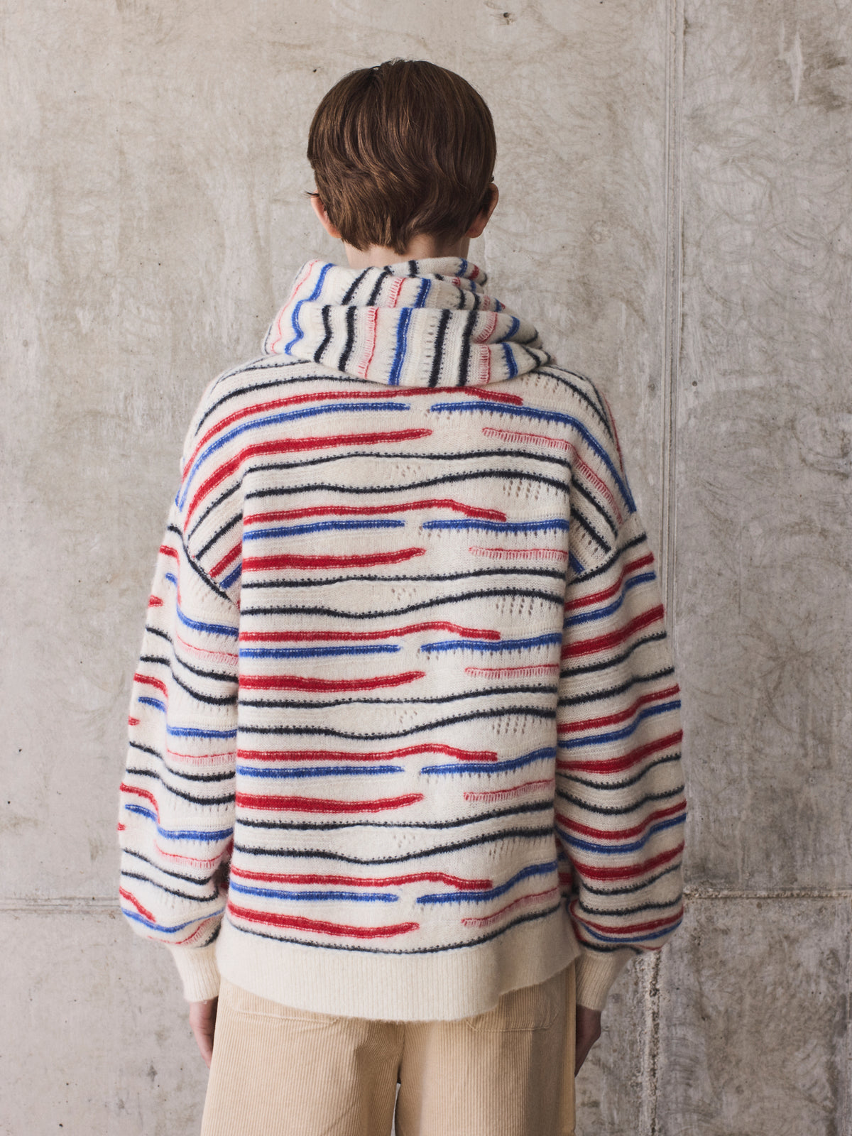 Striped knit sweater with integrated scarf