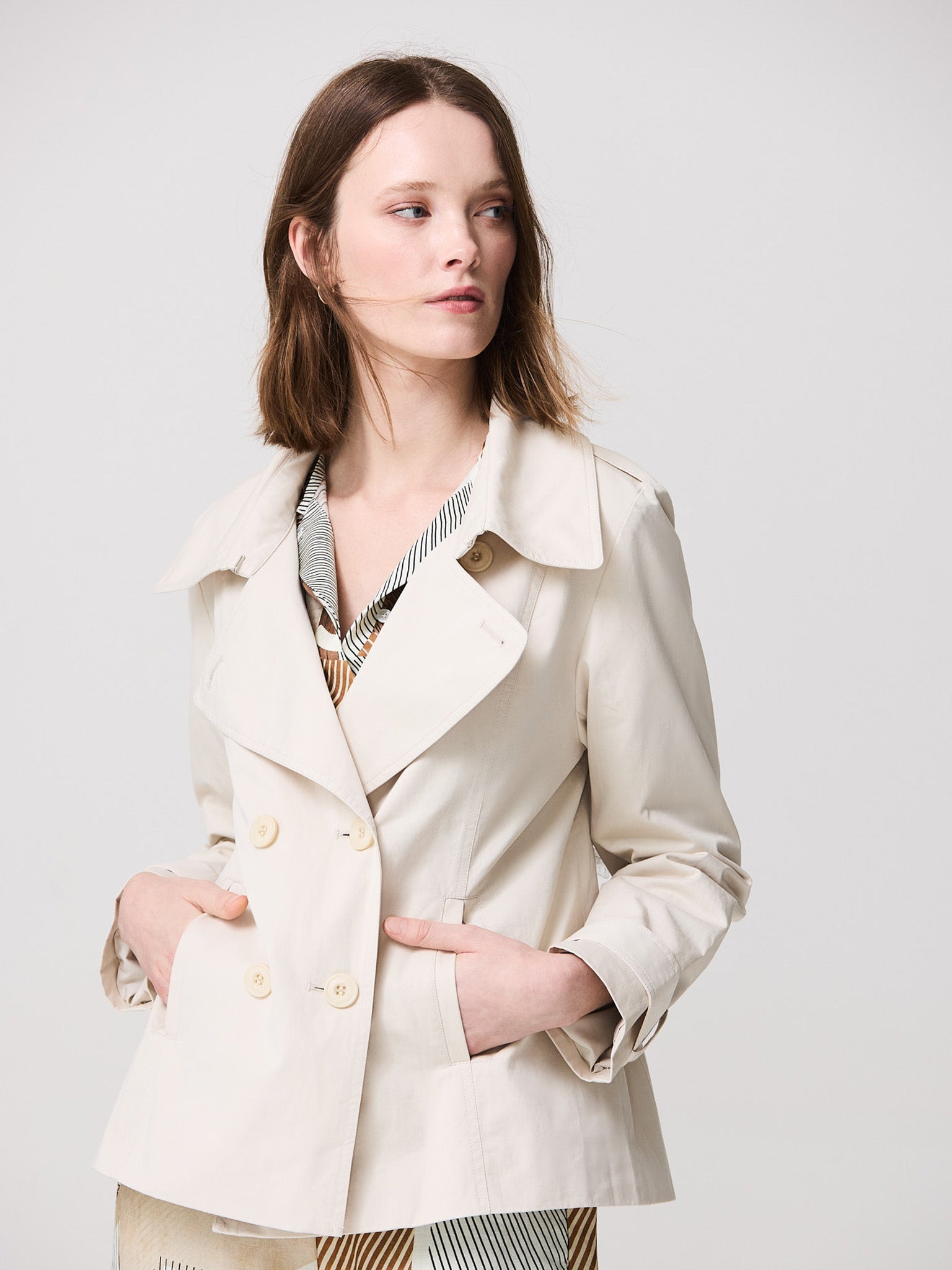 Trench coat with buttons