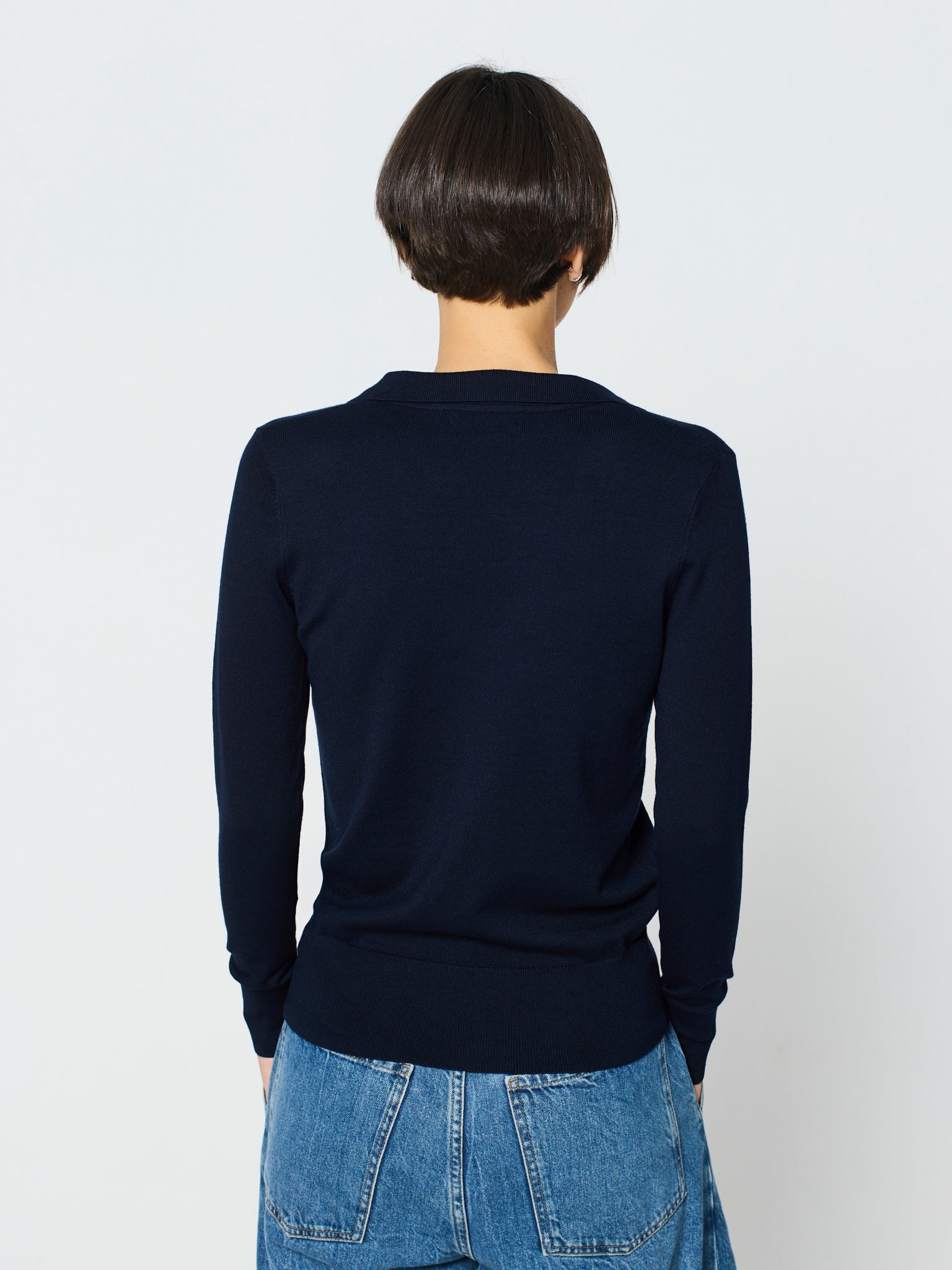 Jersey cuello polo y manga larga con detalle canalé ancho en puños y bajo